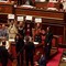 Caso Delmastro, protesta dei 5 Stelle al Senato: banchi del governo occupati e cartelli "Fuori le chat"